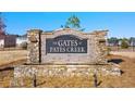 Community entrance sign for The Gates at Pates Creek at 664 Edgar St, Hampton, GA 30228