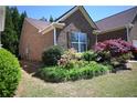 Brick home with mature trees and well-maintained landscaping at 2816 Staunton Dr, Duluth, GA 30097