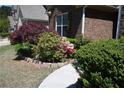 Brick ranch home with manicured landscaping and a curved walkway at 2816 Staunton Dr, Duluth, GA 30097