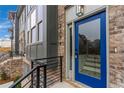 Modern townhome with a blue front door and black metal railing at 2174 Avion Way # 11, Chamblee, GA 30341