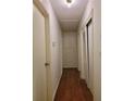 Long hallway with wood flooring and built-in storage at 3321 S Norcross Tucker Rd, Tucker, GA 30084