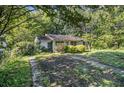 One-story home with a grassy yard and walkway at 2472 Perry Nw Blvd, Atlanta, GA 30318