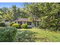 White one-story home with a small front yard at 2472 Perry Nw Blvd, Atlanta, GA 30318