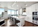 Modern white kitchen with stainless steel appliances and city view at 3344 Peachtree Ne Rd # 3902, Atlanta, GA 30326