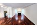 Bright living room with hardwood floors and fireplace at 8740 Roswell Rd # 9D, Atlanta, GA 30350