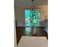 Dining area with glass-top table and sliding glass doors leading outdoors at 1433 Woodland Sw Ter, Atlanta, GA 30311