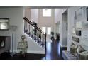 Bright and spacious entryway with elegant staircase and hardwood floors at 2532 Ozella Sw Pl, Atlanta, GA 30331