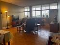 Living room featuring hardwood floors, large windows, and ample natural light at 3060 Pharr Court North Nw # 609, Atlanta, GA 30305