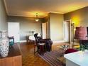 Spacious living room with hardwood floors, comfortable seating, and city views at 3060 Pharr Court North Nw # 609, Atlanta, GA 30305