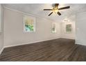 Spacious living room featuring hardwood floors and ceiling fan at 2576 Godfrey Nw Dr, Atlanta, GA 30318