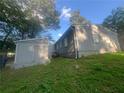 Gray house with boarded-up windows and a small shed at 366 Hamilton E Holmes Nw Dr, Atlanta, GA 30318