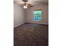 Bedroom with carpet flooring, ceiling fan, and a window at 2936 Parc Lorraine # 2936, Lithonia, GA 30038