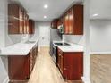 Simple kitchen with light brown cabinets and white countertops at 4318 Christine Ct, Decatur, GA 30035