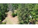 Aerial view of a wooded lot with a shed at 2576 E Paulding Dr, Dallas, GA 30157