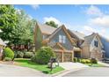 Gray townhome with two-car garage and manicured lawn at 1400 Village Creek Se Cir # 12A, Atlanta, GA 30316