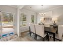 Dining room with chandelier and view into the living room at 558 Abbott Se Ct, Atlanta, GA 30354