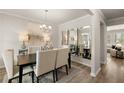 Elegant dining room with a large table and mirror at 558 Abbott Se Ct, Atlanta, GA 30354