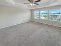 Main bedroom with carpet and multiple windows at 2286 Foley Park St, Snellville, GA 30078