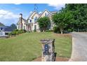 House exterior with stone accents and manicured lawn at 761 Hardage Farm Nw Dr, Marietta, GA 30064