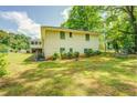 Side view of a ranch house with a large backyard at 500 Cochran Rd, Covington, GA 30014