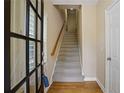 Bright entryway with hardwood floors and staircase leading to upper level at 4740 Legacy Cove Ln, Mableton, GA 30126