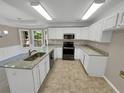 Updated kitchen with granite countertops and stainless steel appliances at 421 Thornbush Trce, Lawrenceville, GA 30046