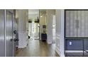 Bright entryway with hardwood floors and access to other rooms at 557 Saltbox Ln, Mcdonough, GA 30252