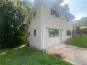 Brick home with attached garage and a private yard at 1870 Glen Echo Dr, Decatur, GA 30032