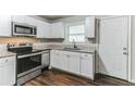 Modern kitchen featuring stainless steel appliances and granite countertops at 2069 Chicago Nw Ave, Atlanta, GA 30314