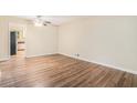 Dining area with wood-look flooring and views into the kitchen at 2519 Brentwood Rd, Decatur, GA 30032