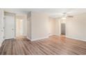 Open living area with hardwood floors, neutral walls, and access to other rooms at 2519 Brentwood Rd, Decatur, GA 30032