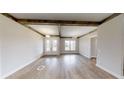 Bright dining room with hardwood floors and exposed beams at 542 Little Vine Church Rd, Villa Rica, GA 30180