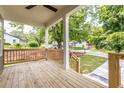 Relaxing front porch with wooden flooring and view of street at 63 Holly Nw Rd, Atlanta, GA 30314