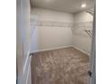 Spacious walk-in closet with wire shelving at 967 Sutherland Lane(Lot 128), Lawrenceville, GA 30043