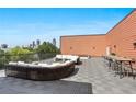 Spacious rooftop patio with modern furniture and city views at 525 Parkway Ne Dr # 305, Atlanta, GA 30308