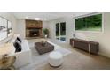 Finished basement with a stone fireplace and sliding door access at 2140 Fern Valley Sw Dr, Atlanta, GA 30331