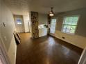 Dining area with access to back deck and unique wall art at 612 Mincey Woods Ct, Stone Mountain, GA 30087