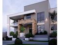 Luxury two-story home with stone accents and large windows at 4821 Neal Rdg, Atlanta, GA 30349