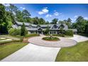 Luxury home showcasing extensive landscaping at 2883 W Roxboro Ne Rd, Atlanta, GA 30324