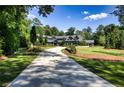 Luxury home with circular driveway and manicured landscaping at 2883 W Roxboro Ne Rd, Atlanta, GA 30324