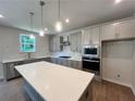 Modern kitchen with white quartz countertops and gray cabinets at 29 Riverbirch Ct, Dallas, GA 30157