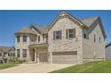 Two-story brick home with three-car garage at 4803 Sultana Sw Way, Atlanta, GA 30331