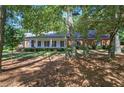 Brick ranch home with covered porch and mature trees at 45 Latimer Nw Ln, Cartersville, GA 30121