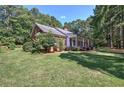 Side view of brick home showcasing landscaping at 45 Latimer Nw Ln, Cartersville, GA 30121