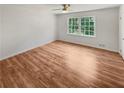 Spacious bedroom with hardwood floors and large windows at 3188 Village Glen Dr, Snellville, GA 30039
