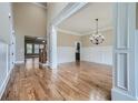 Spacious dining room with hardwood floors and a chandelier at 631 Mabry Rd, Sandy Springs, GA 30328