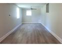 Spacious living room featuring wood-look flooring and neutral walls at 620 Se Lakeridge Se Cir, Conyers, GA 30094