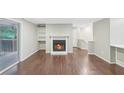 Living room with hardwood floors, fireplace, and patio access at 707 Cumberland Se Ct, Smyrna, GA 30080