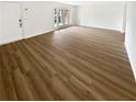 Living room with hardwood floors and access to a patio at 6520 Roswell Rd # 68, Atlanta, GA 30328