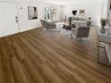Virtually staged living room with hardwood floors and access to a patio at 6520 Roswell Rd # 68, Atlanta, GA 30328